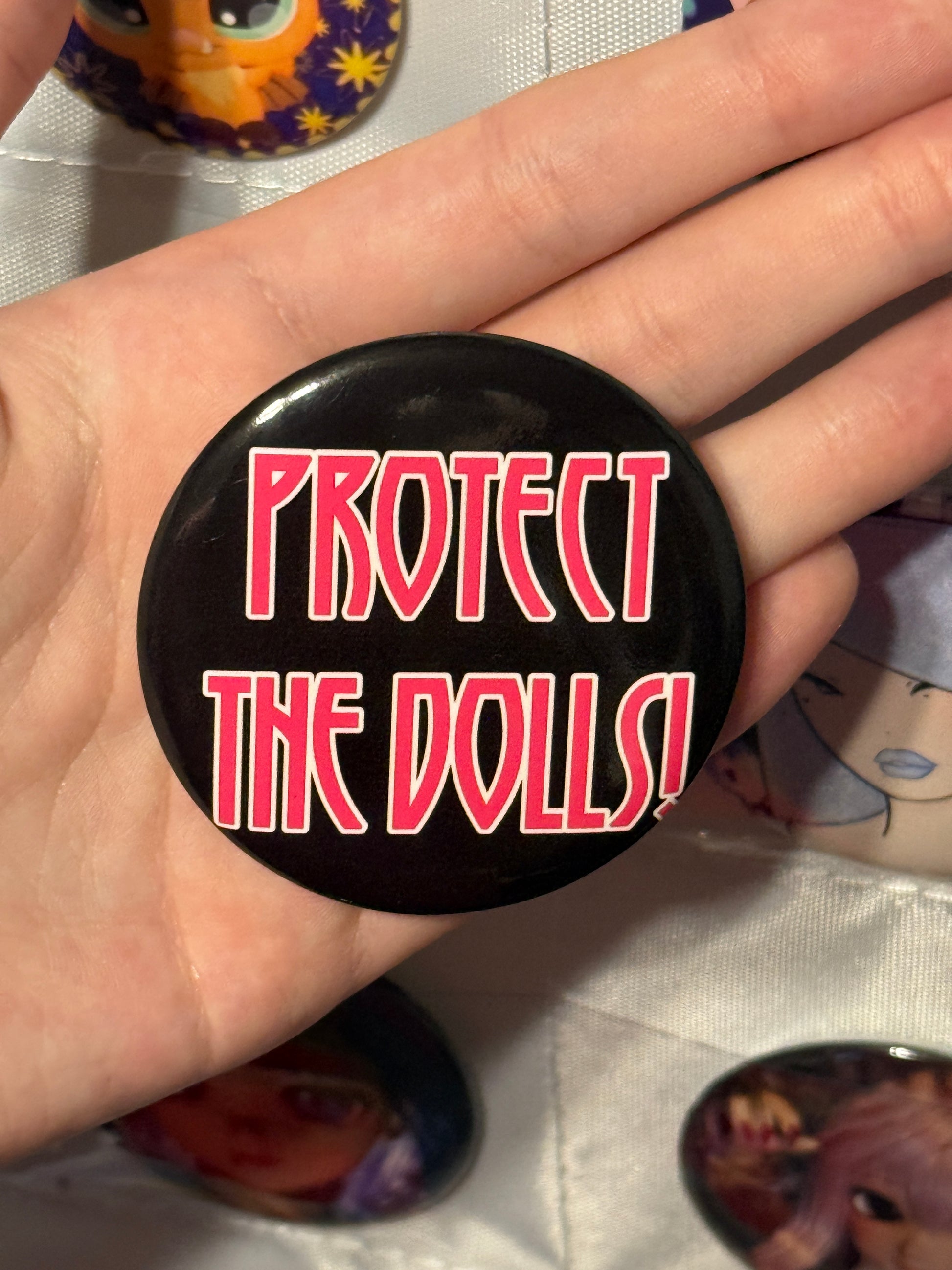 Protect The Dolls Trans 58mm Round Button Pin