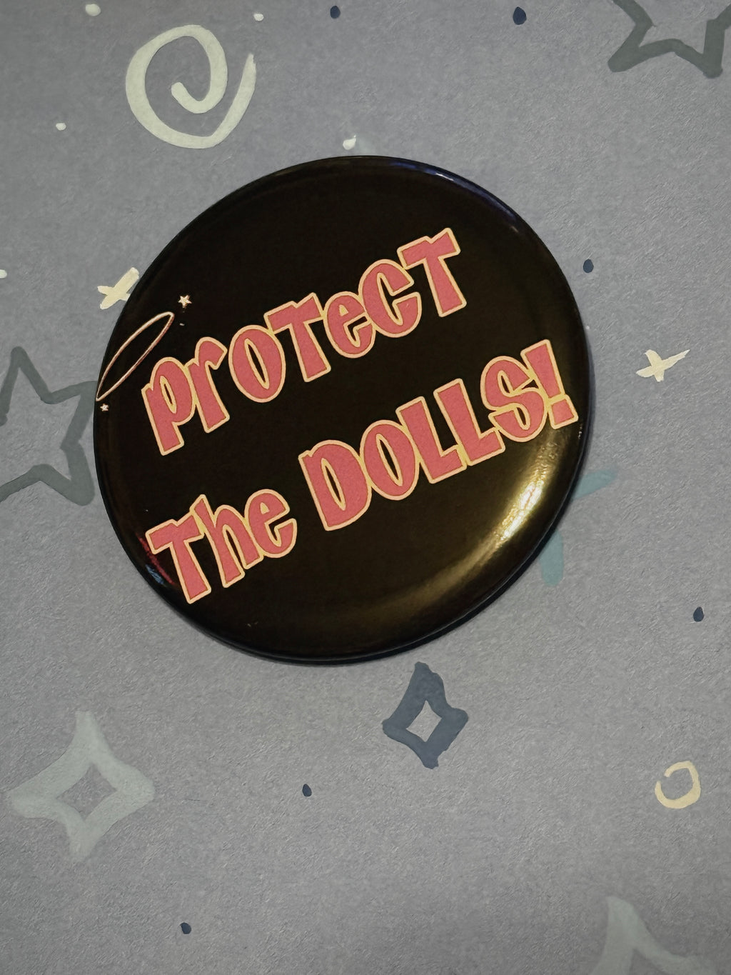 Protect The Dolls Trans 58mm Round Button Pin