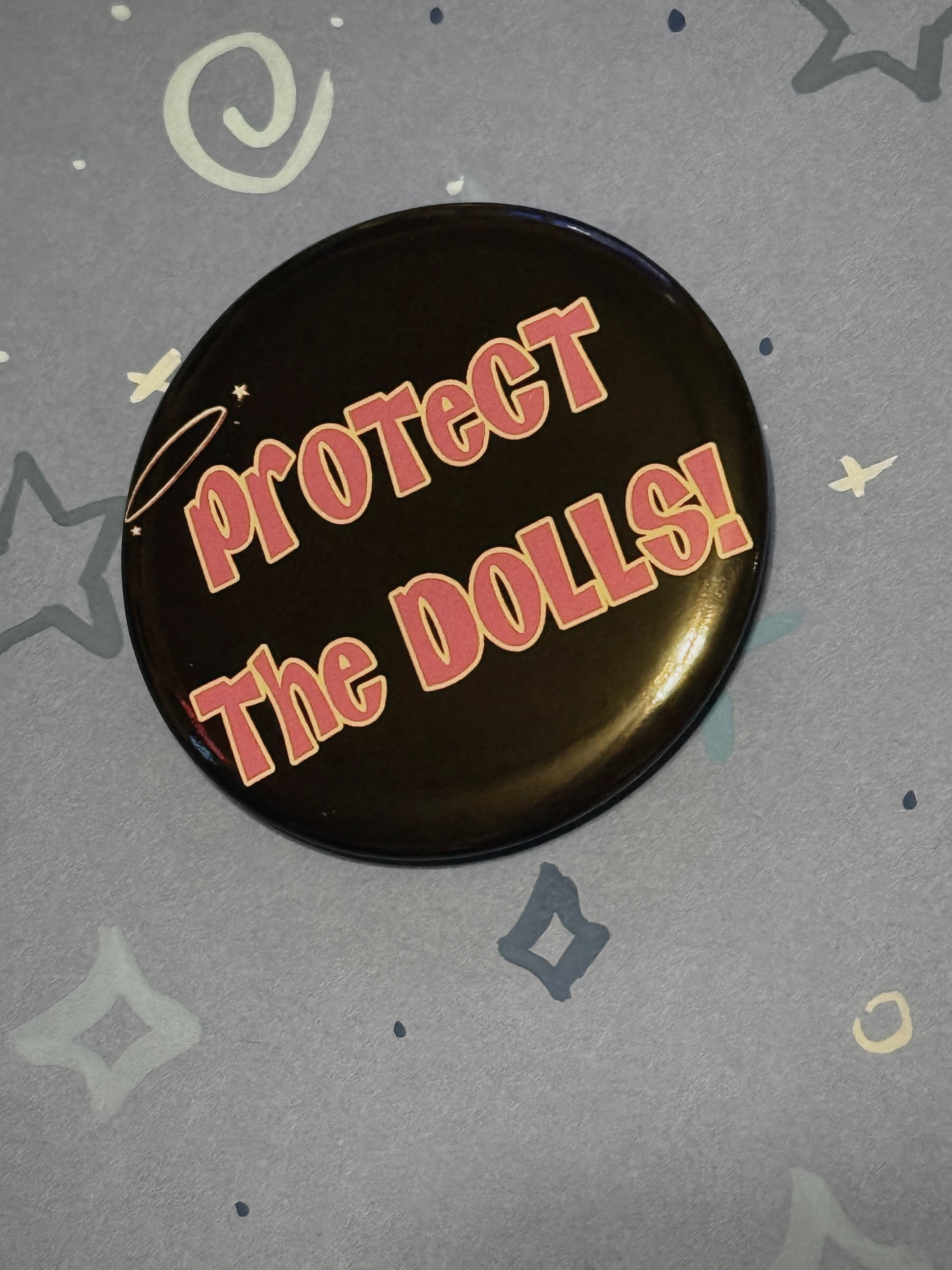 Protect The Dolls Trans 58mm Round Button Pin