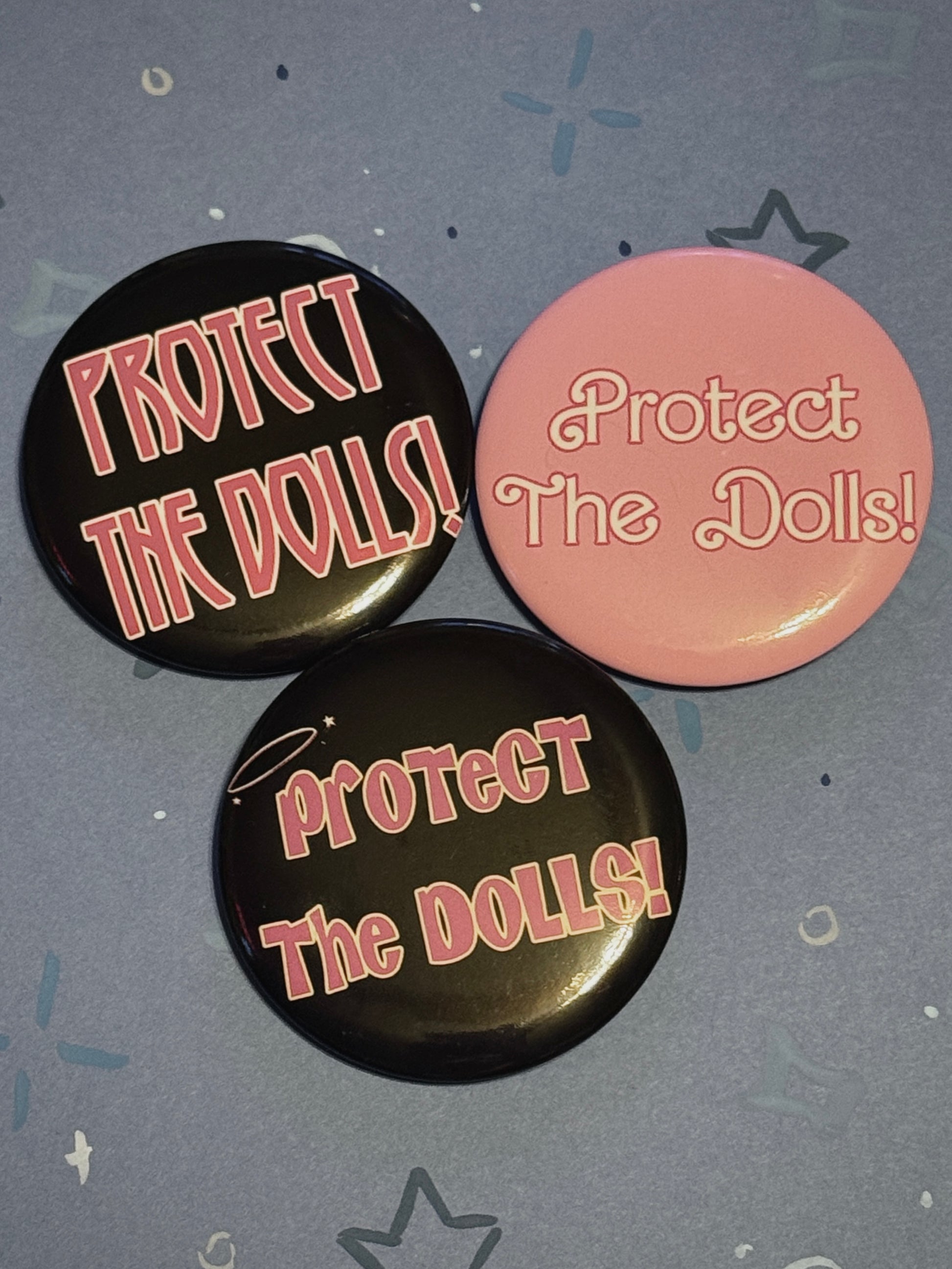Protect The Dolls Trans 58mm Round Button Pin