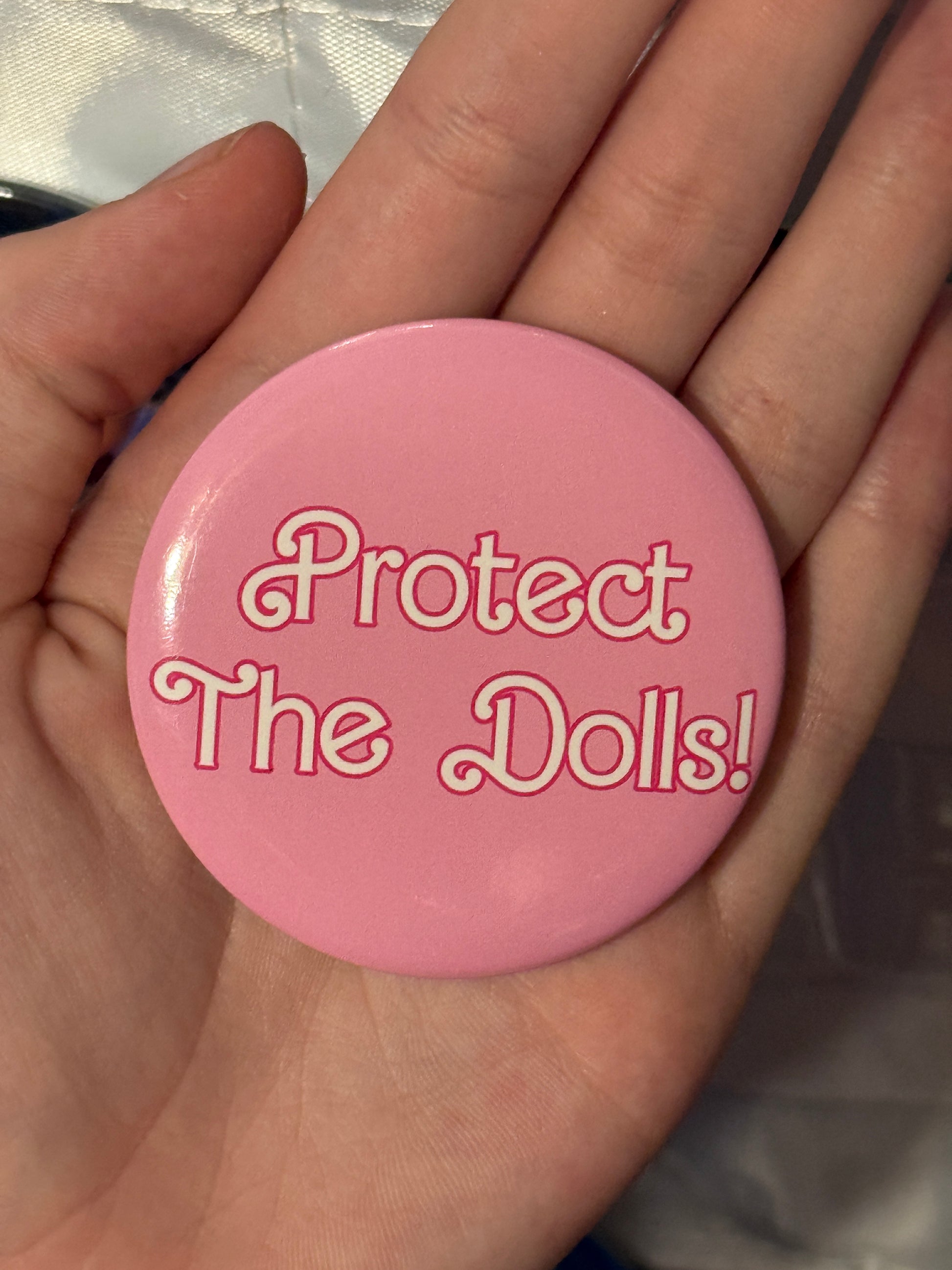 Protect The Dolls Trans 58mm Round Button Pin